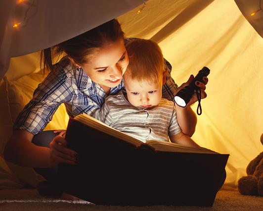 mon reading book to daugther.jpg